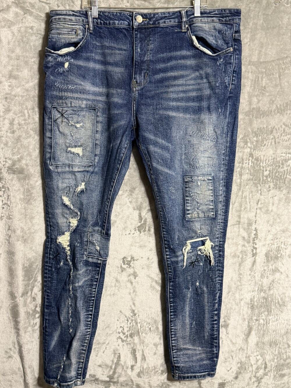 Embellish men's distressed patchwork jeans, tagged size 44.